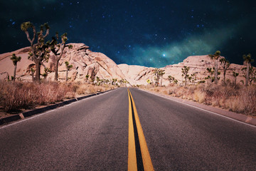 road in the desert on a starry night in California