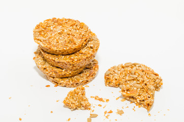 Healthy diet snack close-up. Cereal cookies with nuts isolated on a white background. 