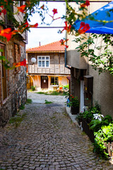 Fototapeta na wymiar Nessebar, Bulgaria, ancient street europe, Tourists on the beautiful streets of Neseba