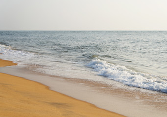 Sunny sandy coast on the ocean on the southern tropical island of Sri Lanka.