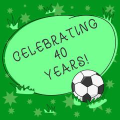 Writing note showing Celebrating 40 Years. Business photo showcasing Honoring Ruby Jubilee Commemorating a special day Soccer Ball on the Grass and Blank Outlined Round Color Shape photo