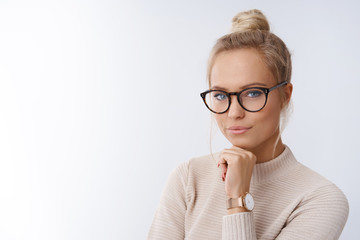 Sassy and successful good-looking accomlished female lifestyle blogger in glasses with blond hair...
