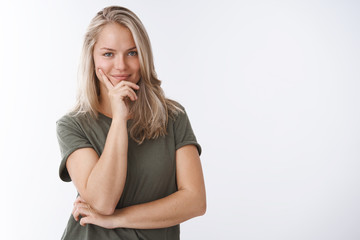 She knows key to success. Portrait of self-assured creative female sportswoman making plan smirking...