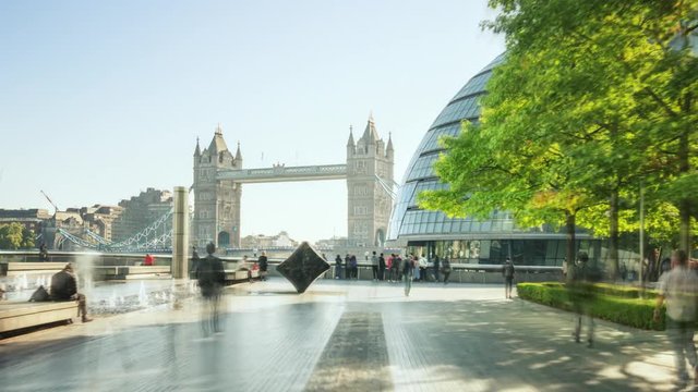hyper lapse of modern buildings and Tower Bridge, London, UK