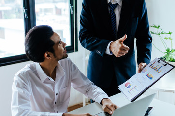 Good job man. business Boss team leader encourage and showing thumbs up expressing positive successful to young man employee in meeting room at home office company, encouragement and teamwork concept