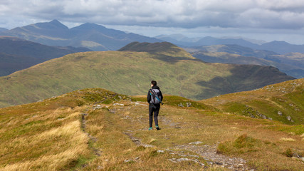 Young girl exploring the beautiful highlands of Scotland.