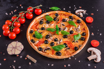 Tasty fresh hot pizza against a dark background. Pizza, food, vegetable, mushrooms