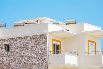 Solar water heating barrels on a house roof