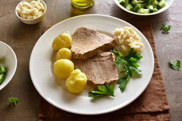 Boiled potatoes with slow cooked beef
