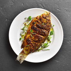 Roasted fish on plate