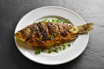 Baked fish on plate