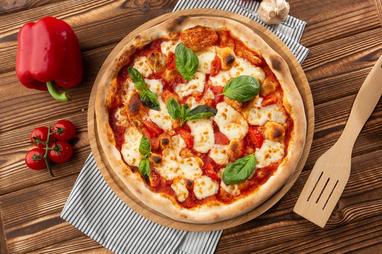Flyer and poster for Restaurants or pizzerias, template with delicious taste margarita pizza, mozzarella cheese, cherry tomatoes.