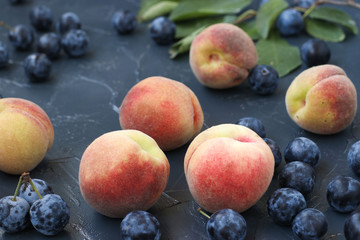 Peaches and blackthorn are located on a dark background