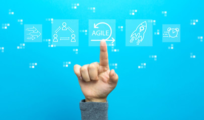 Agile concept with hand on a blue background