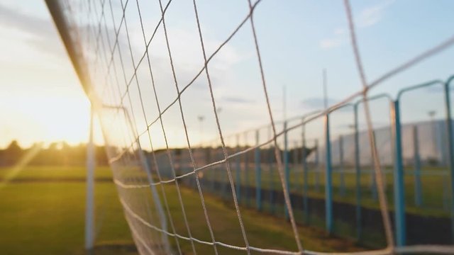 Close up of soccer or football net at sunset