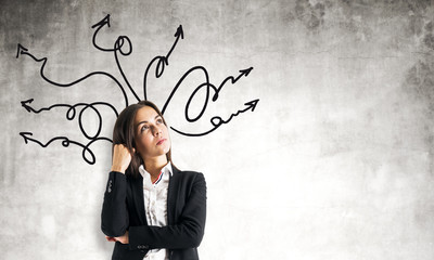 Portrait of attractive businesswoman with arrows