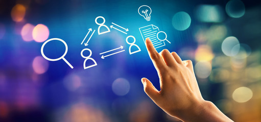 Human resources theme with hand pressing a button on a technology screen