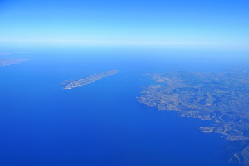 Naklejka na ściany i meble Aerial view of island of Makronisos and the Diavlos Makronisou channel south of Athens in Greece