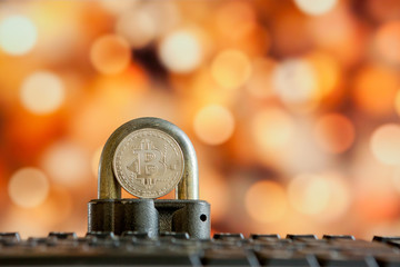Bitcoin currency on keyboard computer on bokee background.Virtual cryptocurrency concept.