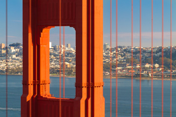 Golden Gate Bridge close-up with San Francisco skyline in background