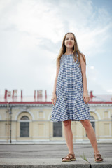 young woman in blue dress