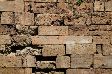 Background texture of limestone blocks wall. Old fortress wall blocks