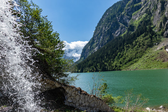 Meltwater flows quickly in the mountain lake. Stillup Lake, Stillup reservoir,  Austria, Tyrol