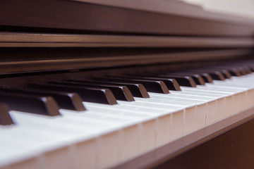 close frontal . The piano was set up in the music room to allow the pianist to rehearse before the classical piano performance in celebration of the great businessman's success .