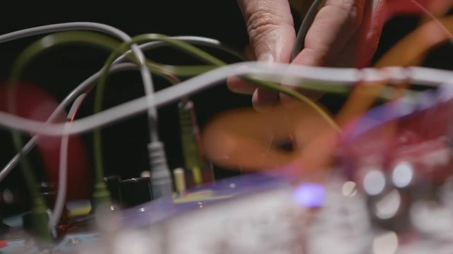 Plugging and unplugging wires soundboard slow motion
