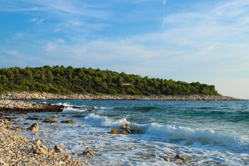 rocky coast with beautiful blue sea and sky