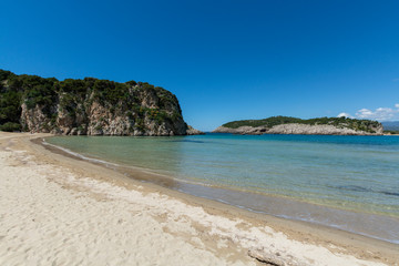 Fototapeta premium Voidokilia Beach, popular white sand and blue clear water beach in Messinia in Mediterranean area in shape of Greek letter omega, Peloponnese, Greece.