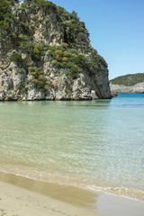 Fototapeta premium Voidokilia Beach, popular white sand and blue clear water beach in Messinia in Mediterranean area in shape of Greek letter omega, Peloponnese, Greece.