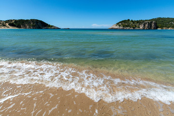 Voidokilia Beach, popular white sand and blue clear water beach in Messinia in Mediterranean area in shape of Greek letter omega, Peloponnese, Greece.