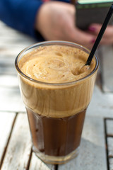 Traditional greek cold coffee Frappe made from water, instant coffee and ice cubes