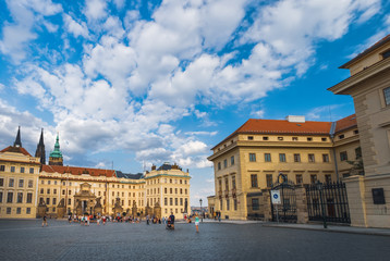 Fototapeta na wymiar Tourists visit the First Courtyard at Hrad Castle - Hradcany square or Hradcanske namesti in Prague, Czech Republic