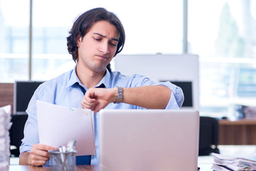 Young employee unhappy with excessive work 