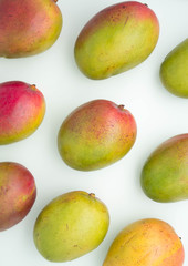 horizontal pattern of rows of colorful mangoes