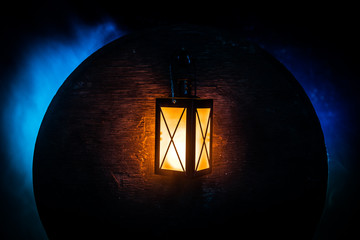 Arabic lantern with candle at night for Islamic holiday. Muslim holy month Ramadan. The end of Eid and Happy New Year.
