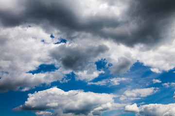 Blue summer sky with lush white clouds