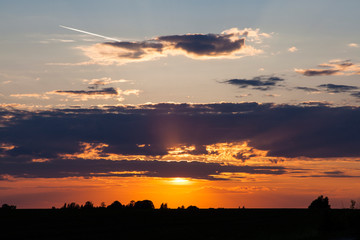 Beautiful summer sunset with scenic clouds