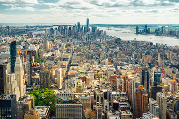 New York City Skyline Aerial View. Hudson River and East River, Ocean and Cloudy Blue Sky on a Horizon