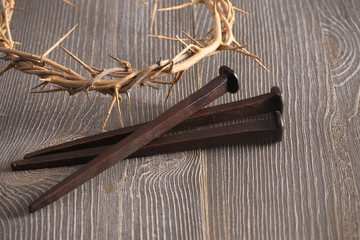 Symbols of the Crucifixion of Jesus Christ on a Wooden Table