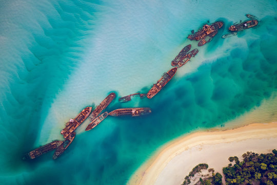 The Tangalooma Wrecks used to be 15 steam driven barges which were deliberately sunk in 1963 along the Moreton Island coastline to form a breakwall so that small boats can anchor in shelter