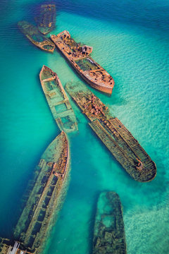 The Tangalooma Wrecks used to be 15 steam driven barges which were deliberately sunk in 1963 along the Moreton Island coastline to form a breakwall so that small boats can anchor in shelter