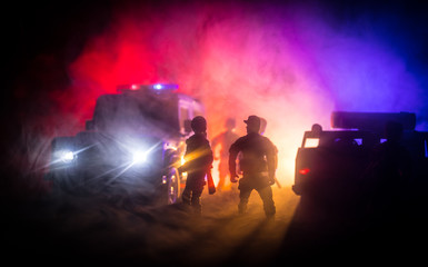 Police cars at night. Police car chasing a car at night with fog background. 911 Emergency response...