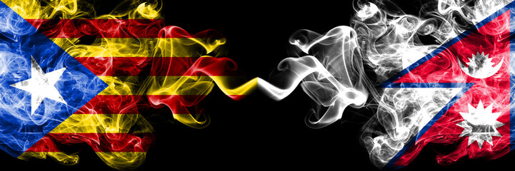 Catalonia vs Nepal, Nepalese smoke flags placed side by side. Thick colored silky smoke flags of Catalonia and Nepal, Nepalese