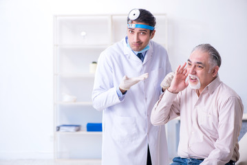 Male patient visiting doctor otolaryngologist