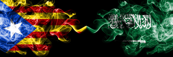 Catalonia vs Saudi Arabia, Arabian smoke flags placed side by side. Thick colored silky smoke flags of Catalonia and Saudi Arabia, Arabian