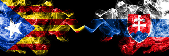 Catalonia vs Slovakia, Slovakian smoke flags placed side by side. Thick colored silky smoke flags of Catalonia and Slovakia, Slovakian