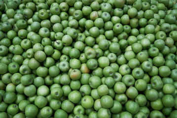 Green apple background, close-up. Healthy diet food 